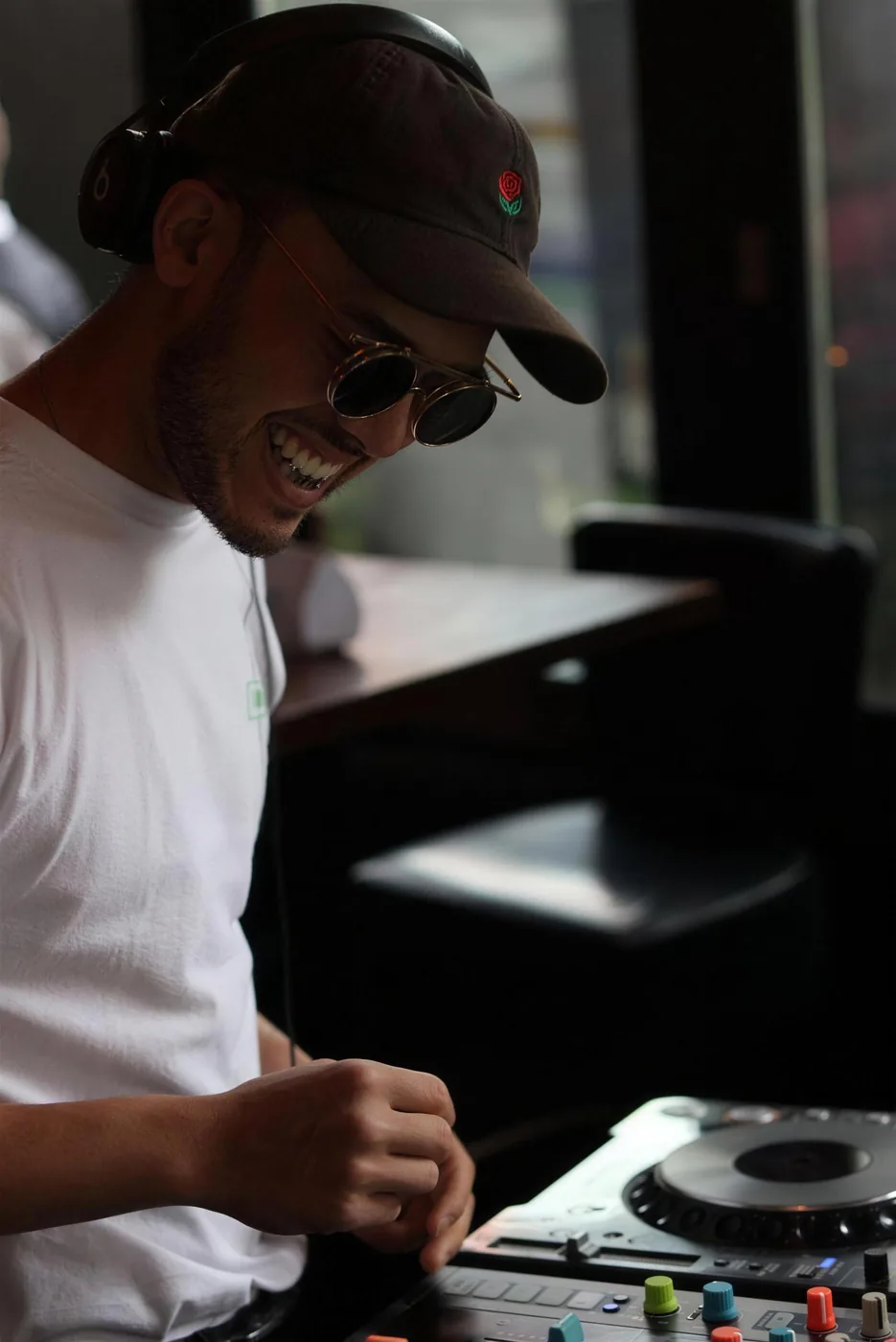 BDJ laughing behind the CDJs at a daytime set